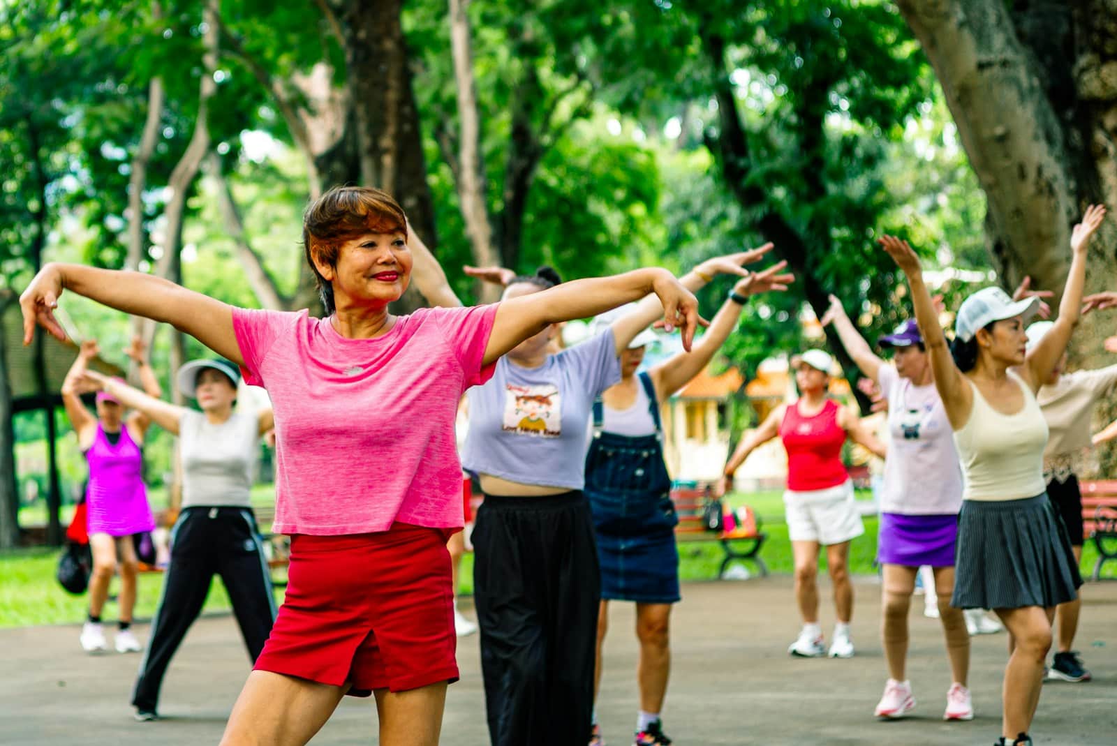 Group of women exercising together in a park