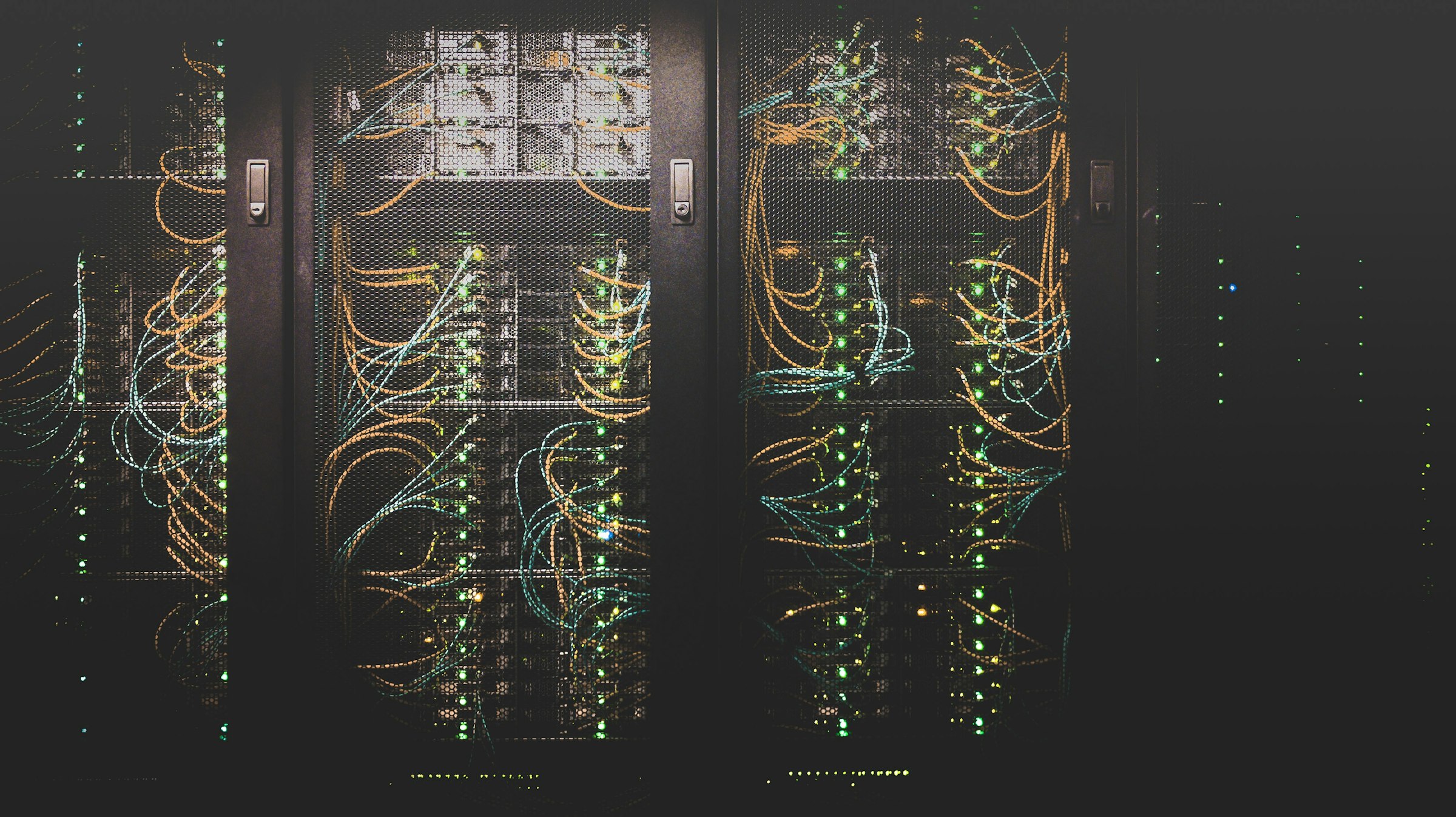 Bundled network cables connecting servers in a data center, illustrating cloud backup infrastructure