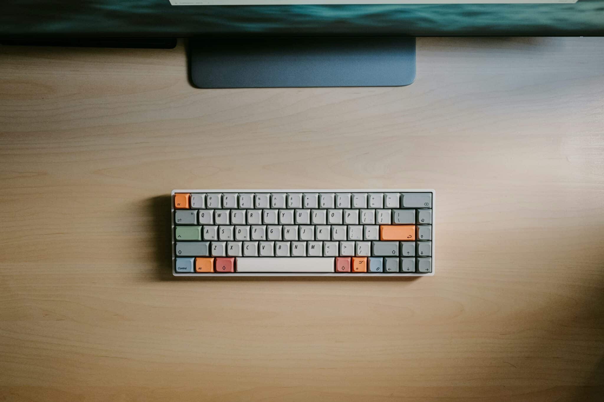 keyboard on a wooden desk