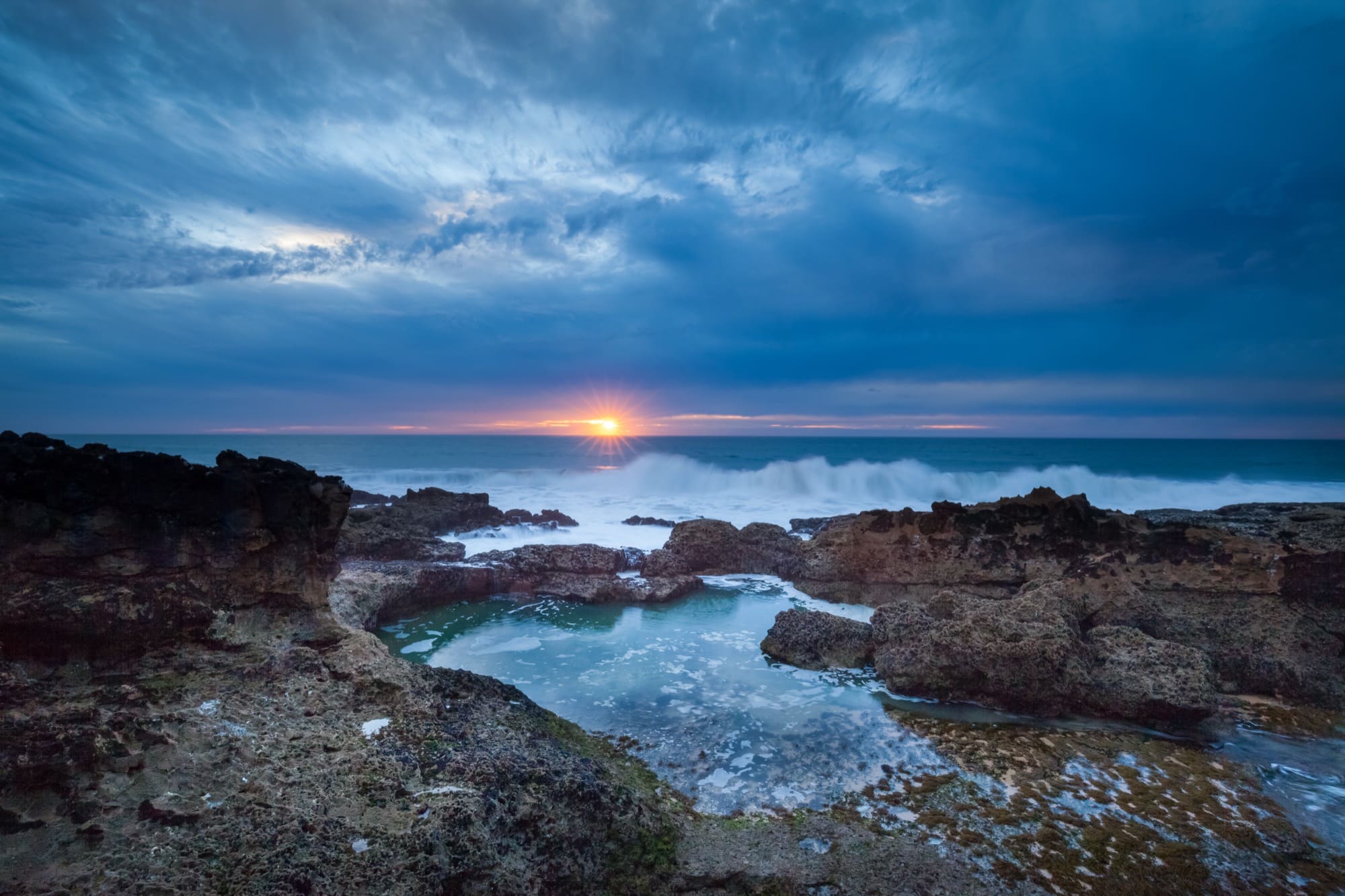 Sunset over the rocky Atlantic coast at Guincho near Cascais, Portugal